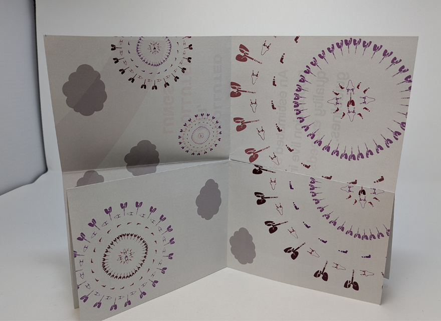 photo of a small piece of paper with a pattern depicitng virus cells spread out vertically