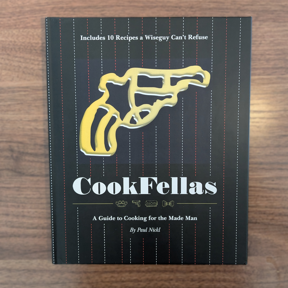 photo of a vinyl sleeve depicting two young men weaaring primitive outfits in front of a large neon moon and a blue and purple background